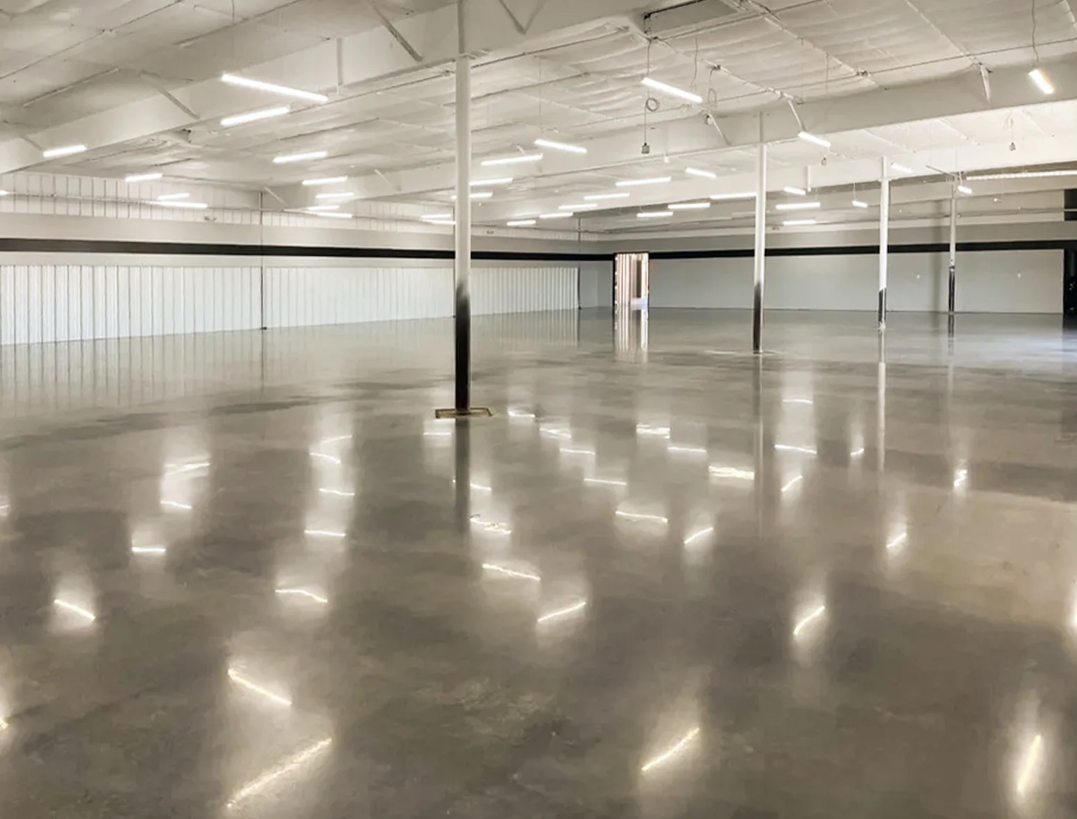 Open industrial facility with polished concrete floors